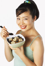 female eating cereal